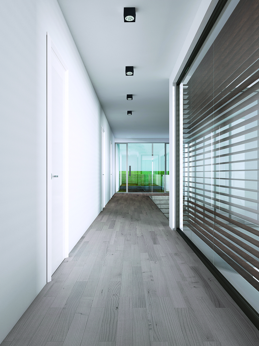 Corridor in a modern house with large windows.